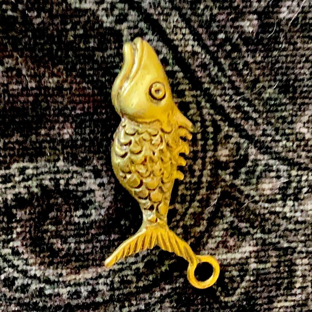 Small hand carved brass fish pendant or charm